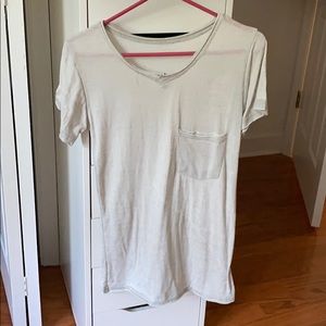 A gray short sleeve top w/ pocket